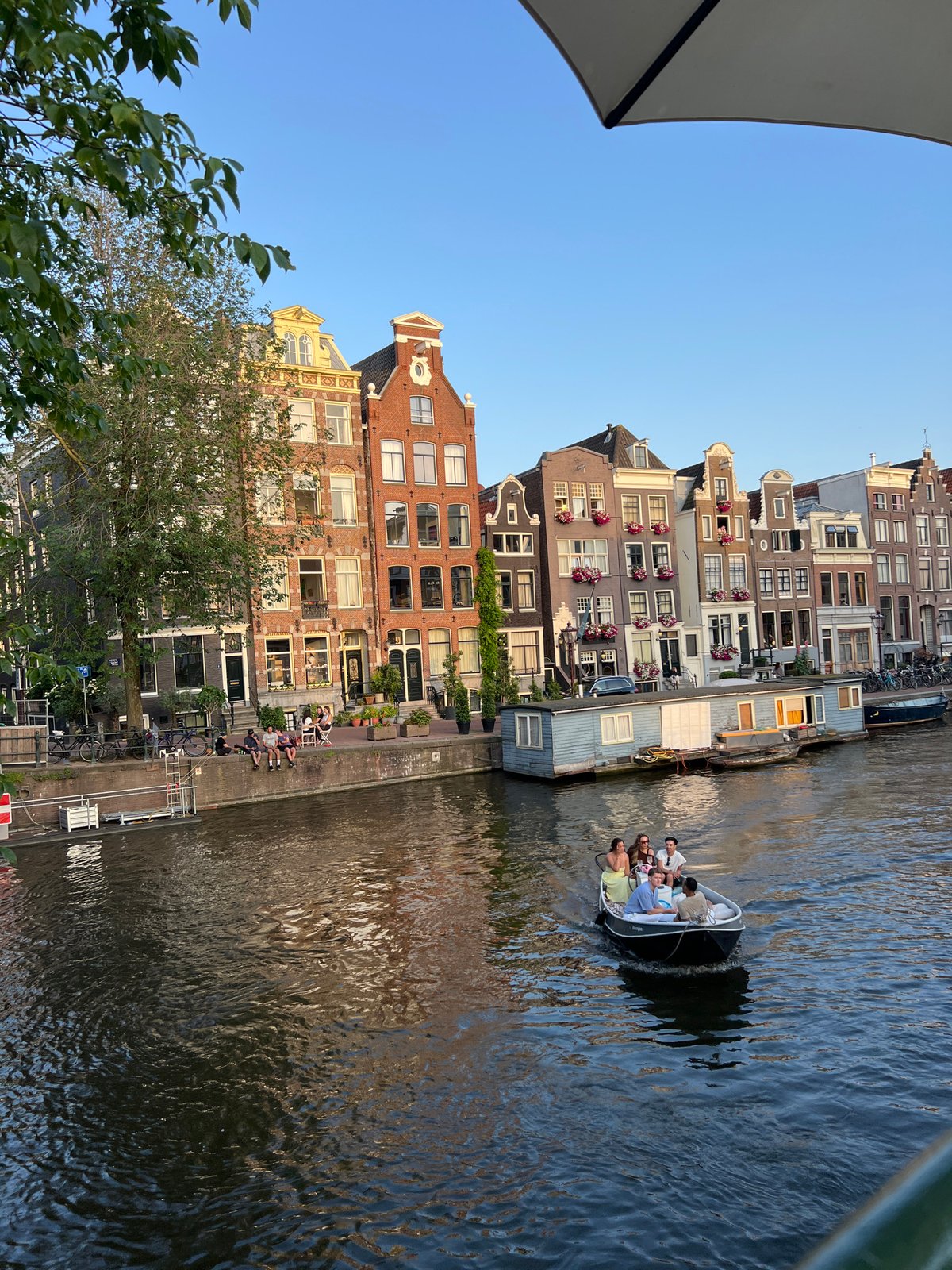 Everyday Amsterdam street life on a clear summer evening