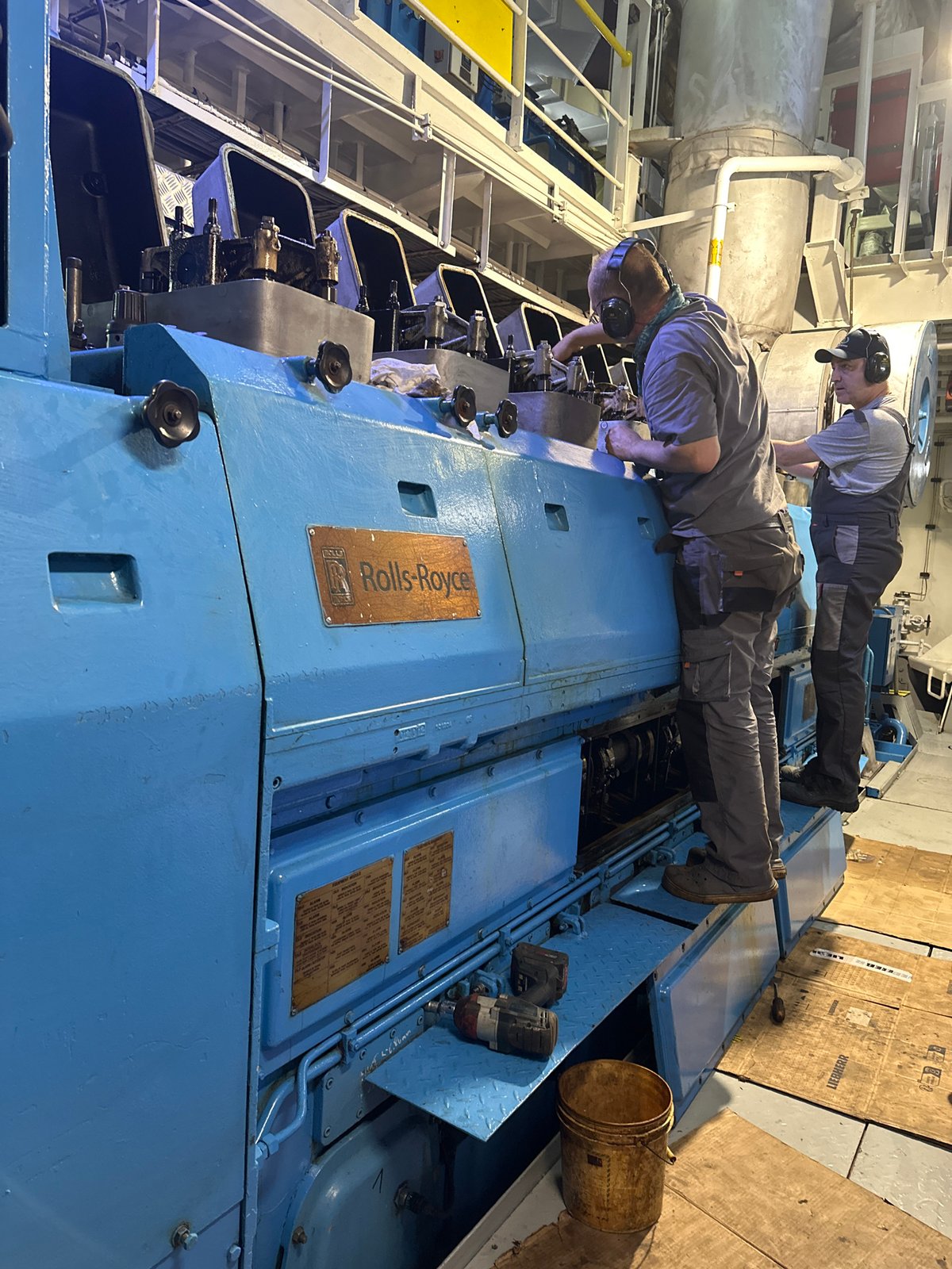 Workers service large industrial engine in Poti facility