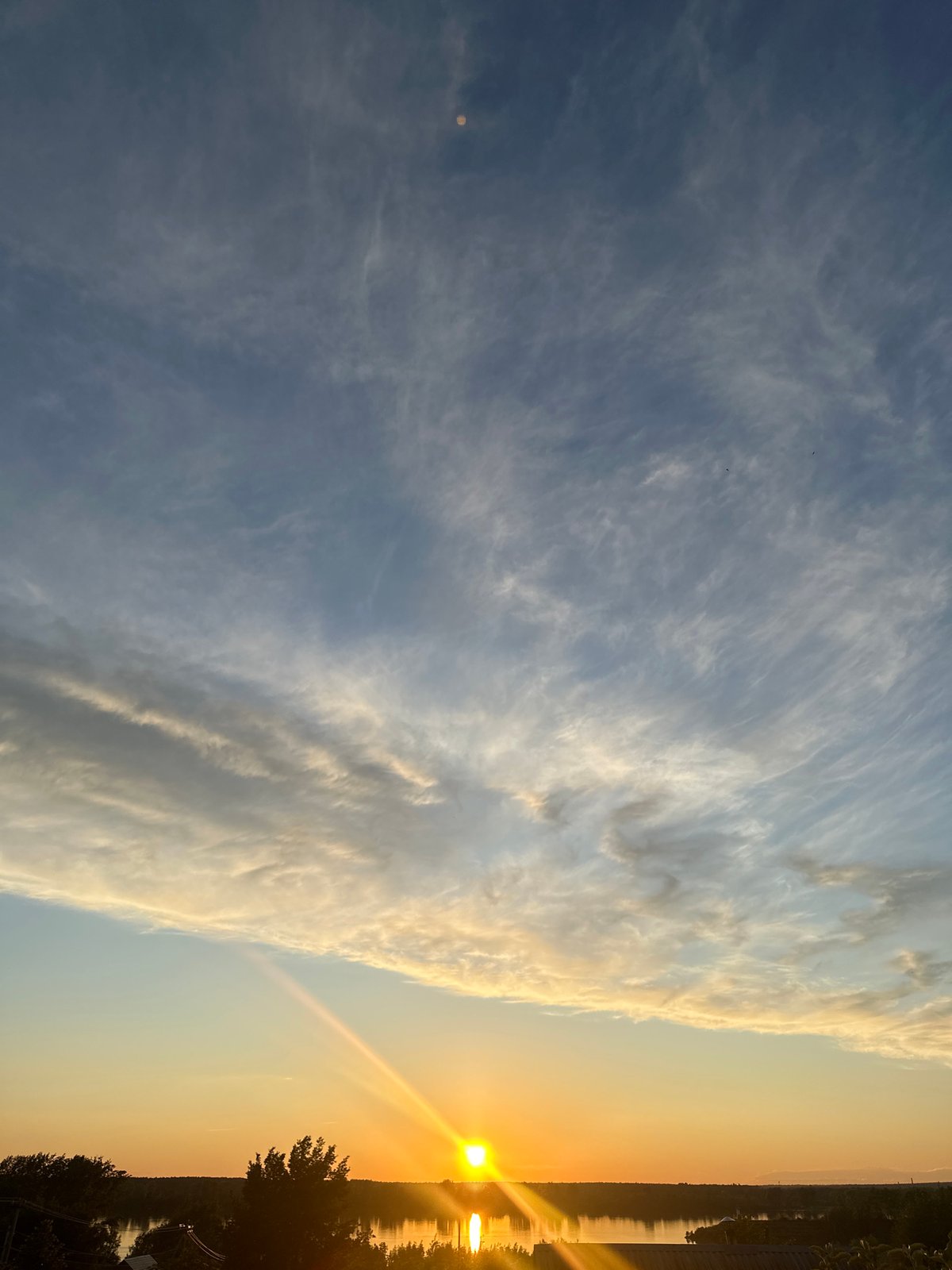 Sunset documented over Chaikovsky waters during golden hour