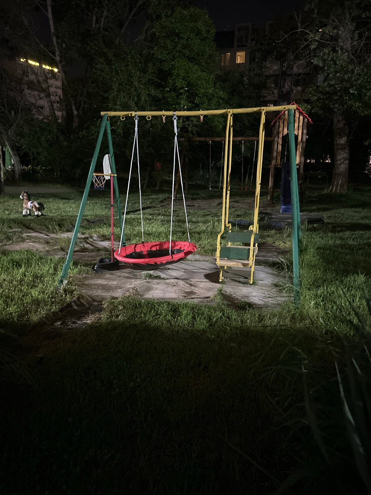 Nighttime playground structure observed under artificial lighting