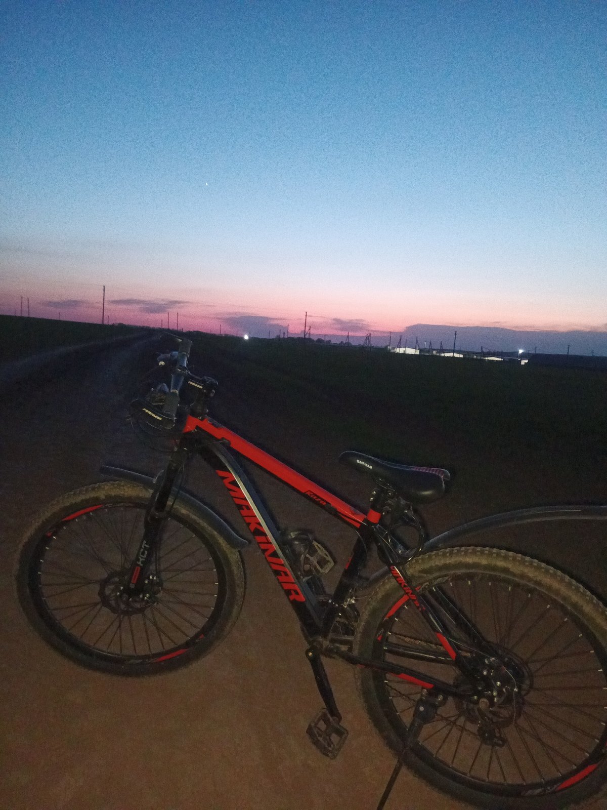 Woman photographs evening bike ride in rural Russia