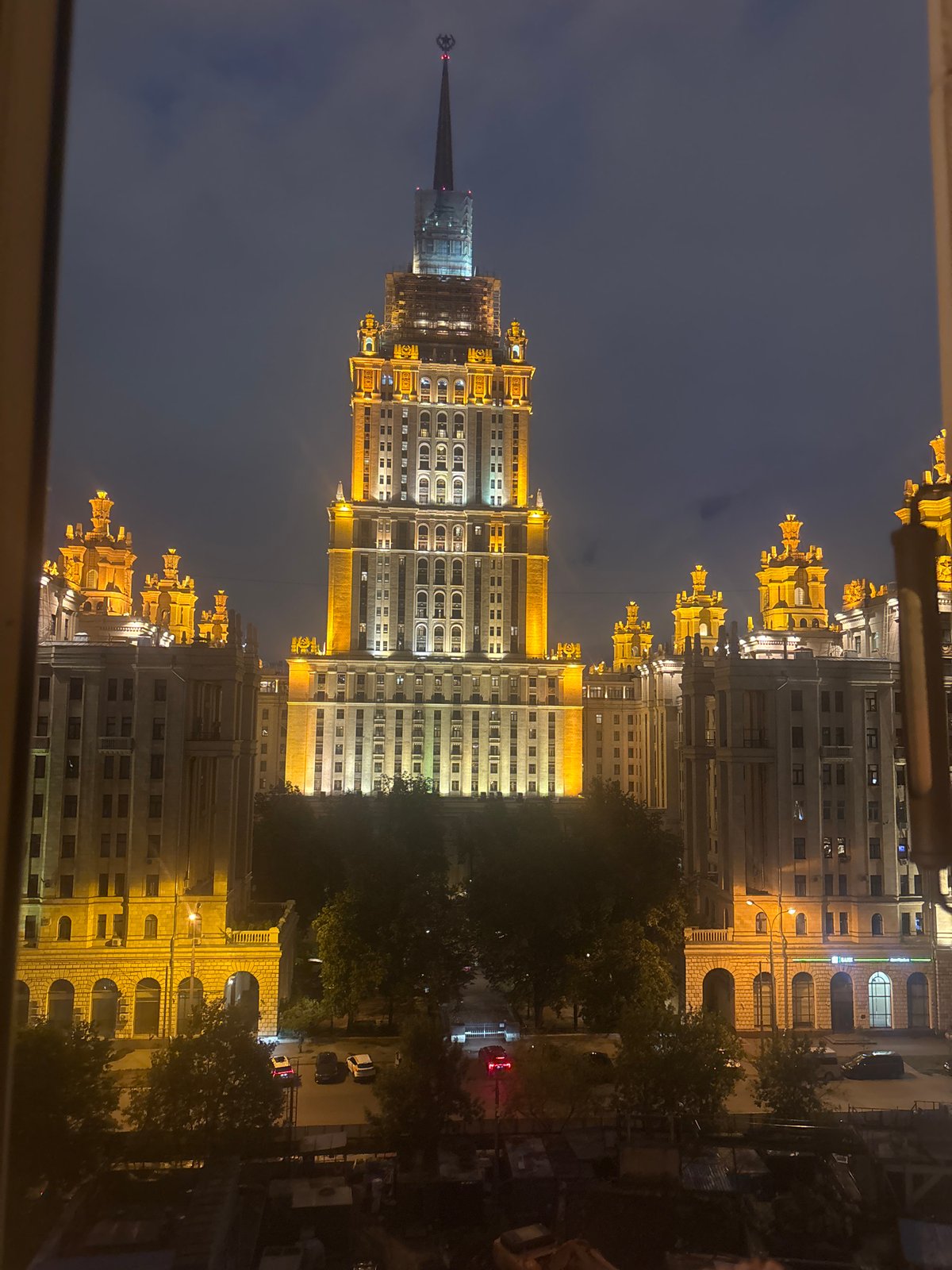 Moscow Stalinist skyscraper glowing at night