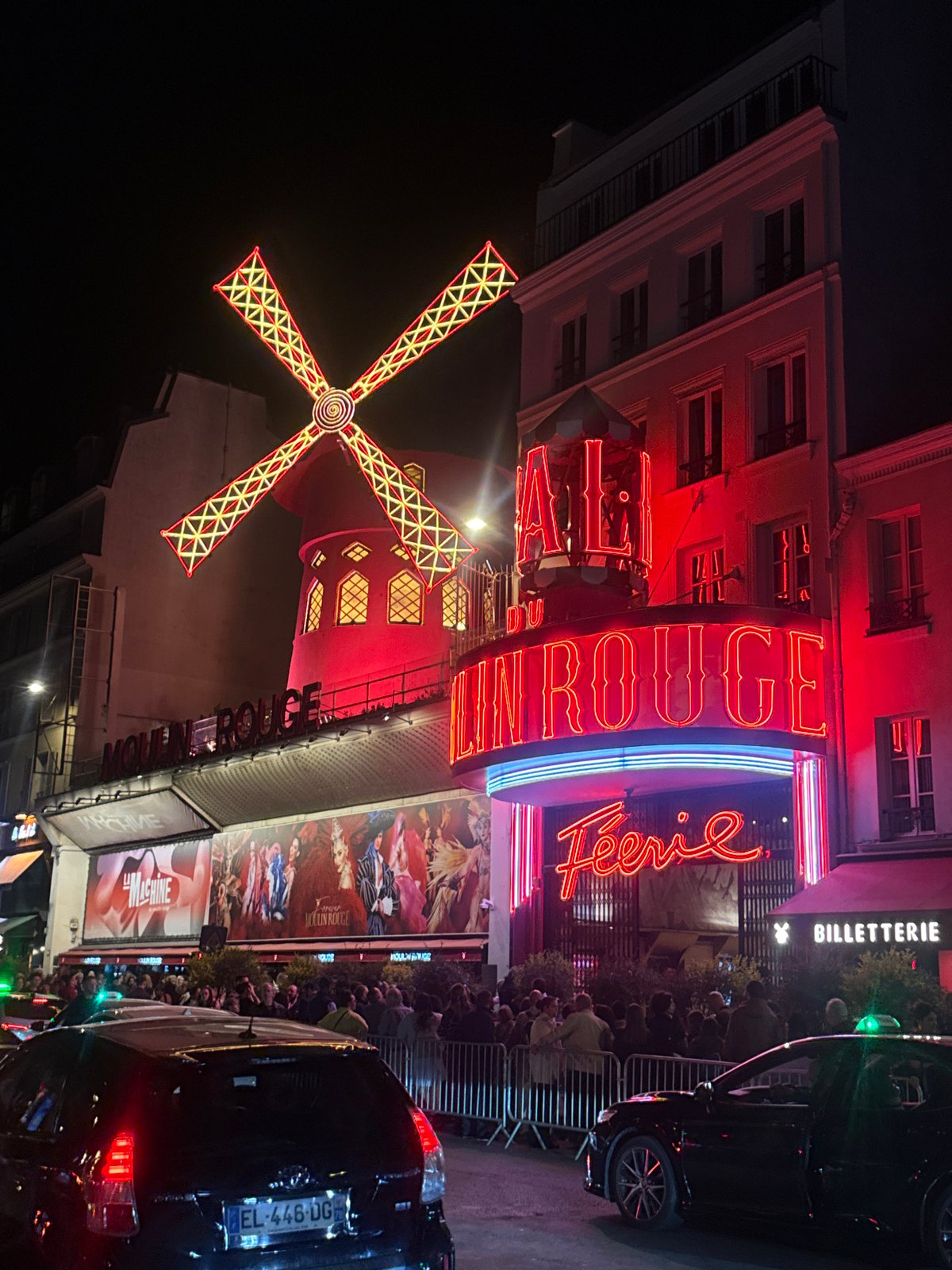 Moulin Rouge cabaret glows in nighttime Paris illumination