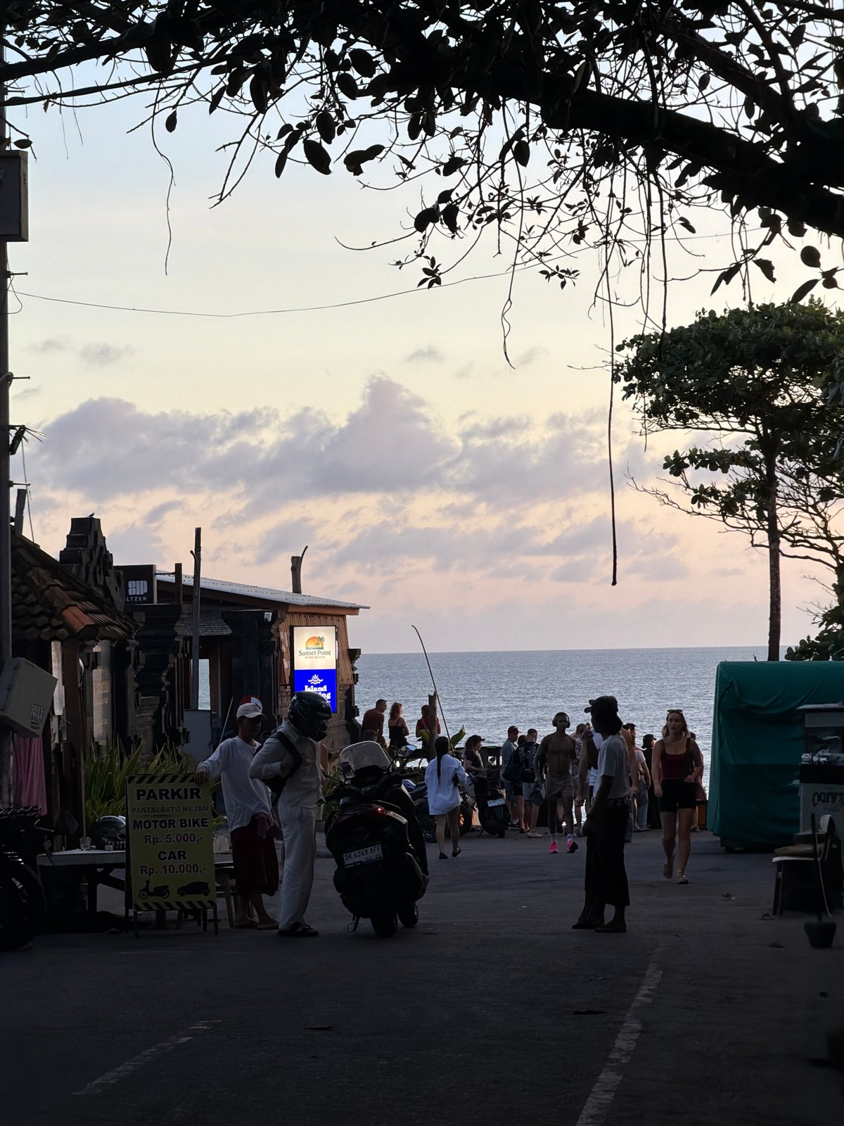 Crowd gathers at Sunset Point seaside location in North Kuta