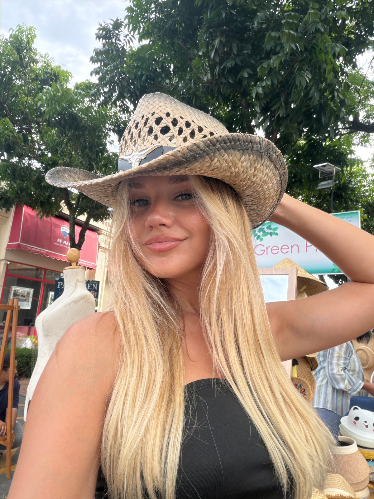 Selfie series at a Choeng Thale market, straw hat and black outfit