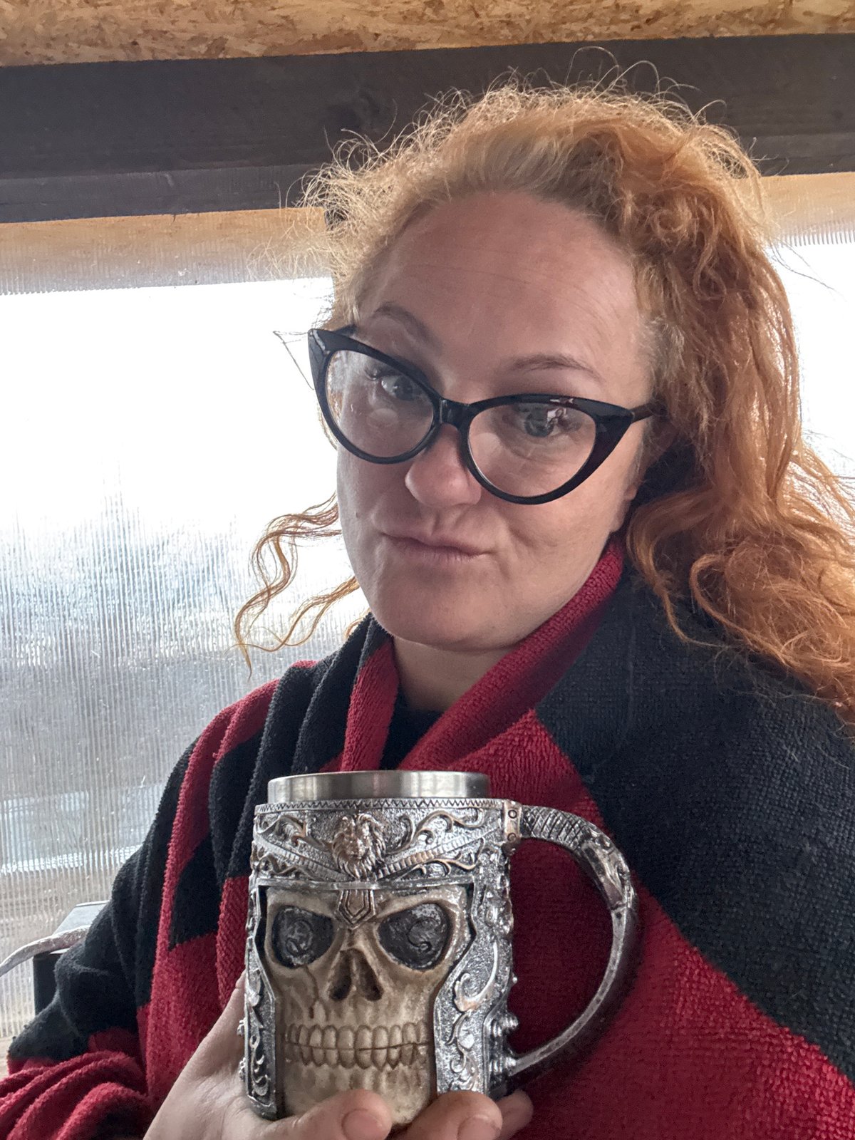 Woman photographed in costume with decorative mugs in Chaikovsky