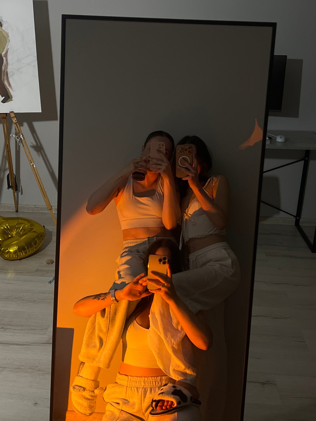 Young women take mirror selfies in Ternopil apartments