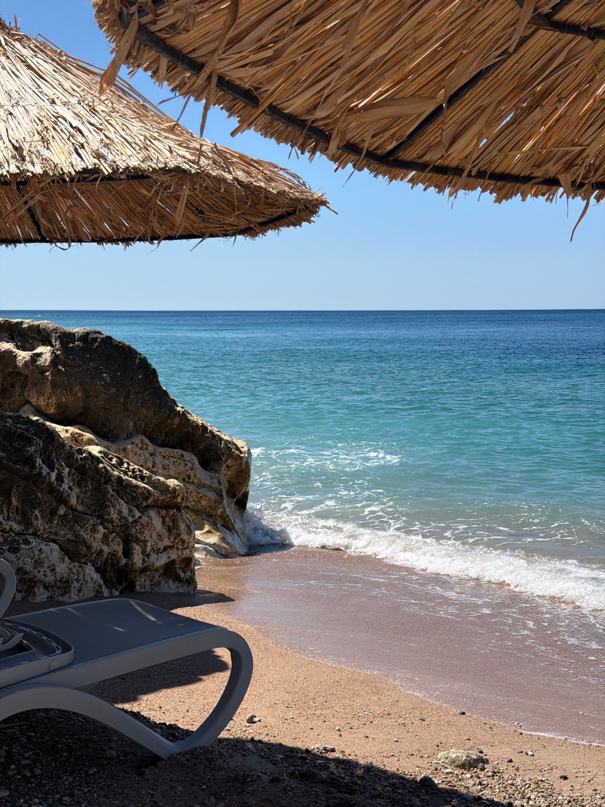 Quiet summer morning on a Montenegrin pebble beach