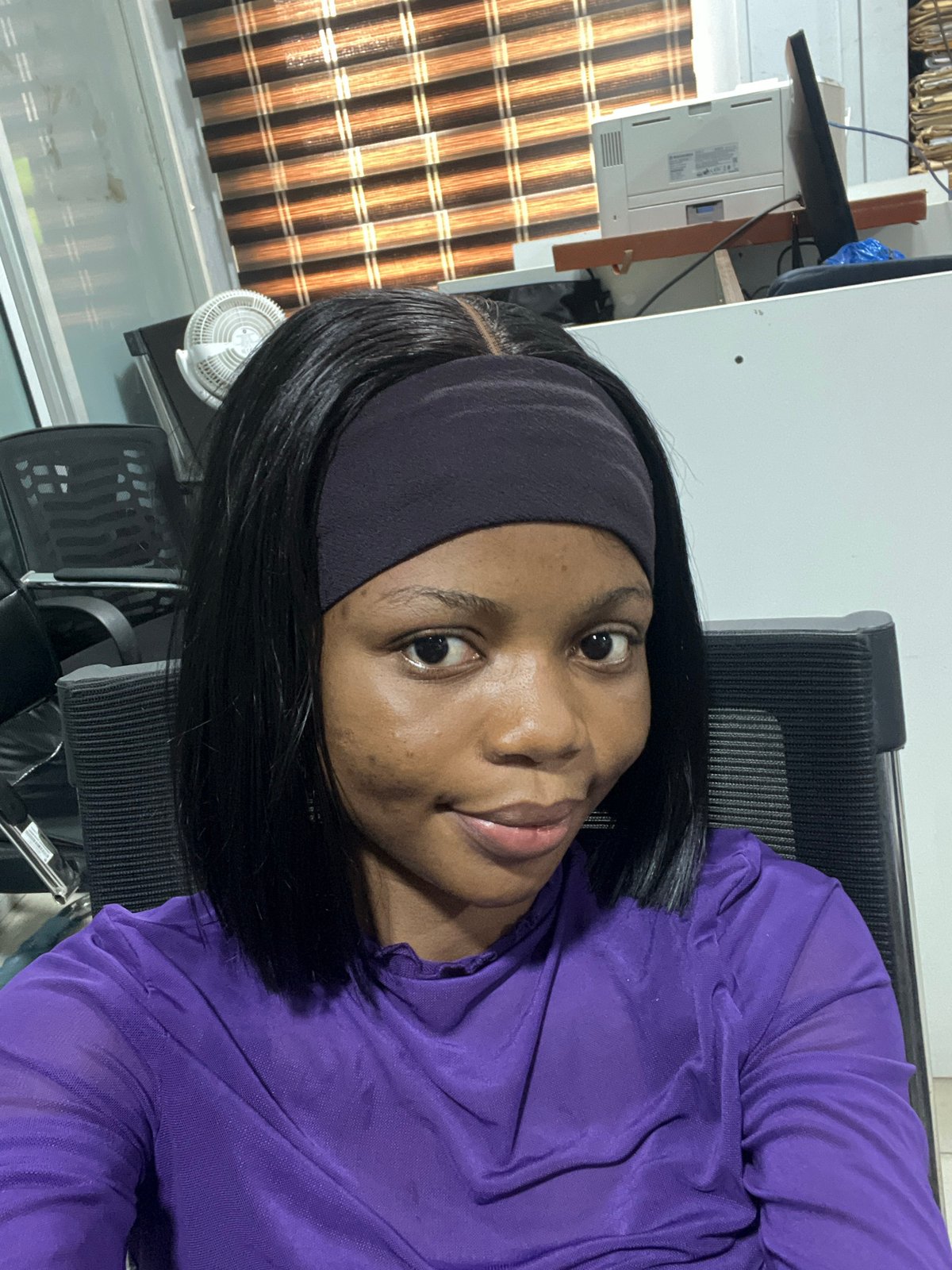Woman photographed at office workspace in Ikeja, Nigeria