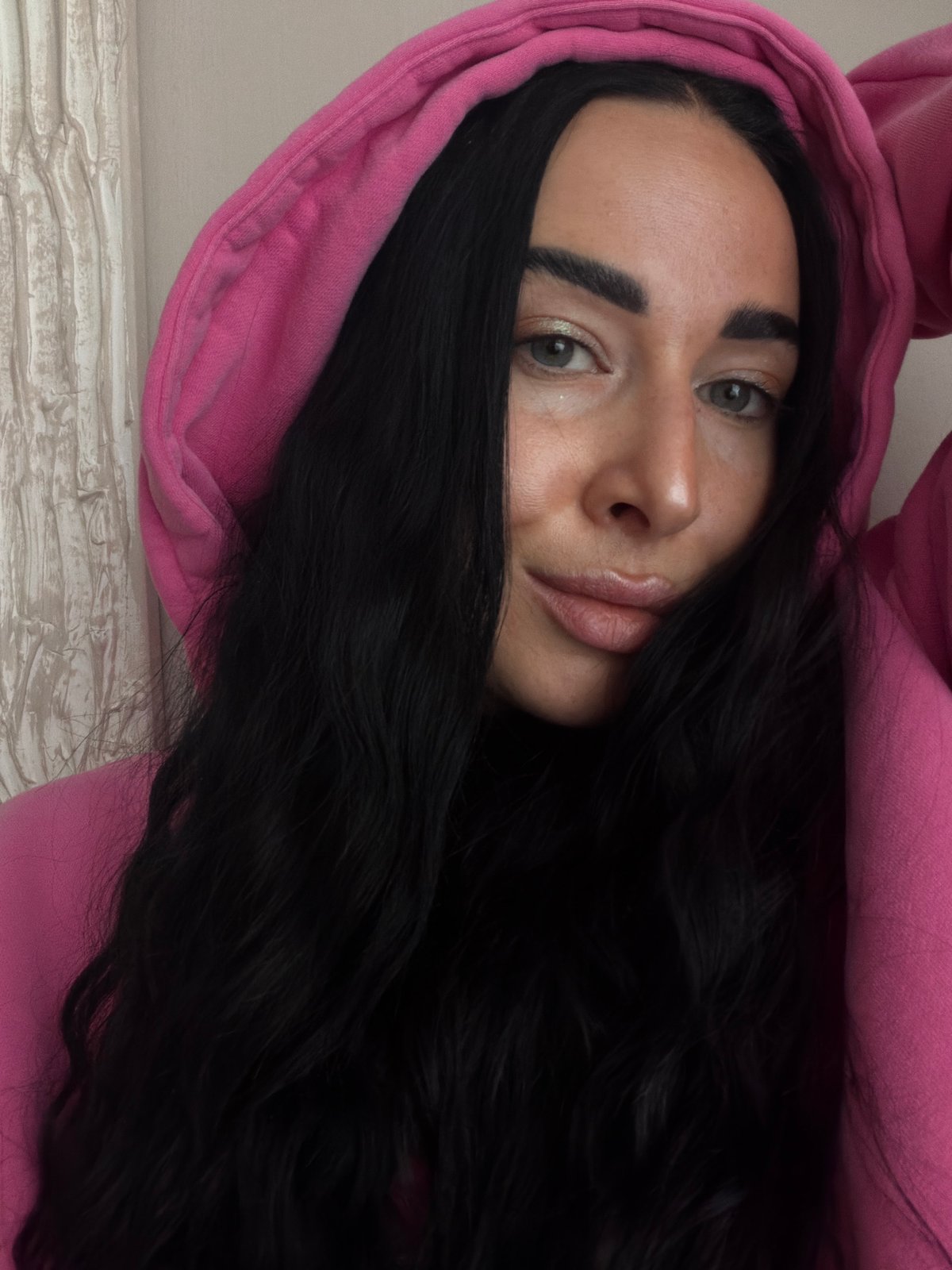 Portrait session captured in Saint Petersburg featuring pink hoodie