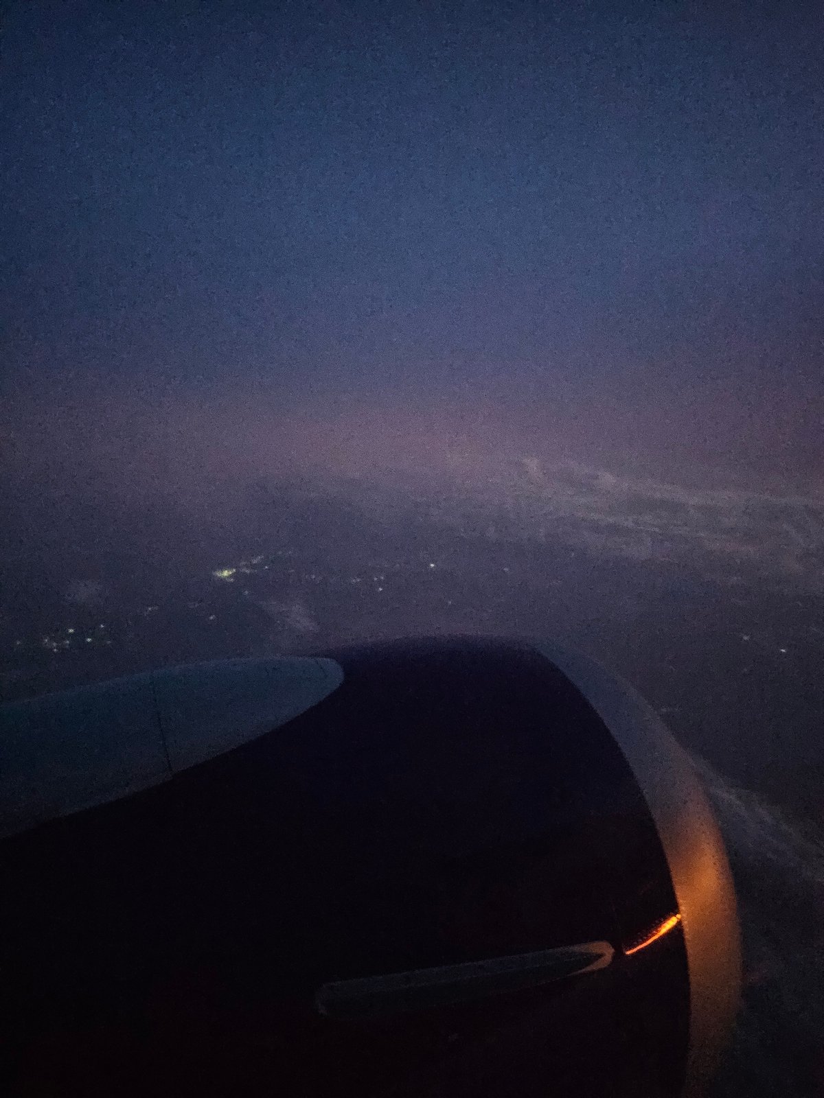 Airplane passenger documents nighttime flight over Turbo, Colombia