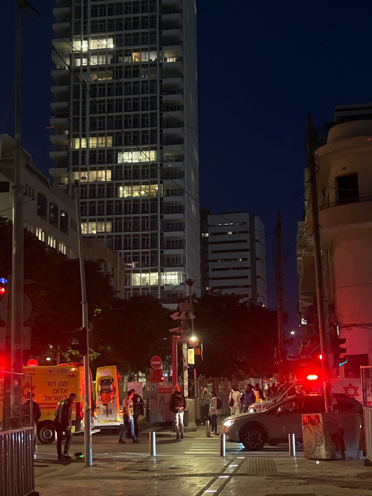 Nighttime street scene with ambulance observed in Tel-Aviv