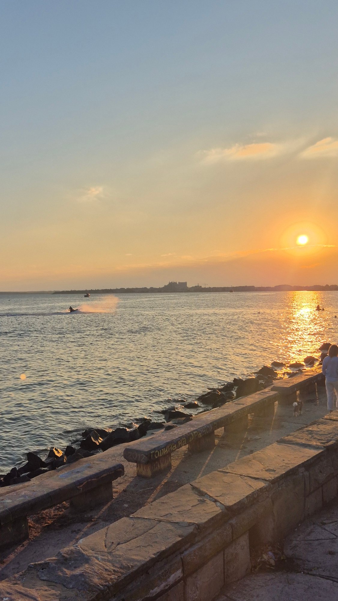 Summer evening on the Pomorie promenade, fairground and sea views