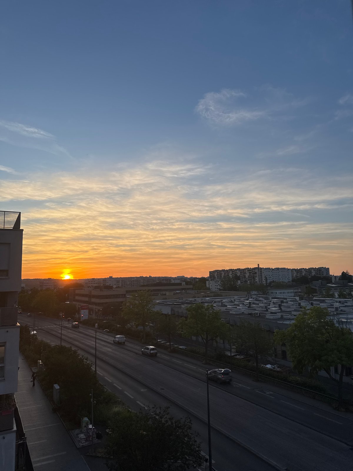 Urban sunset, multiple angles, warm sky over the city