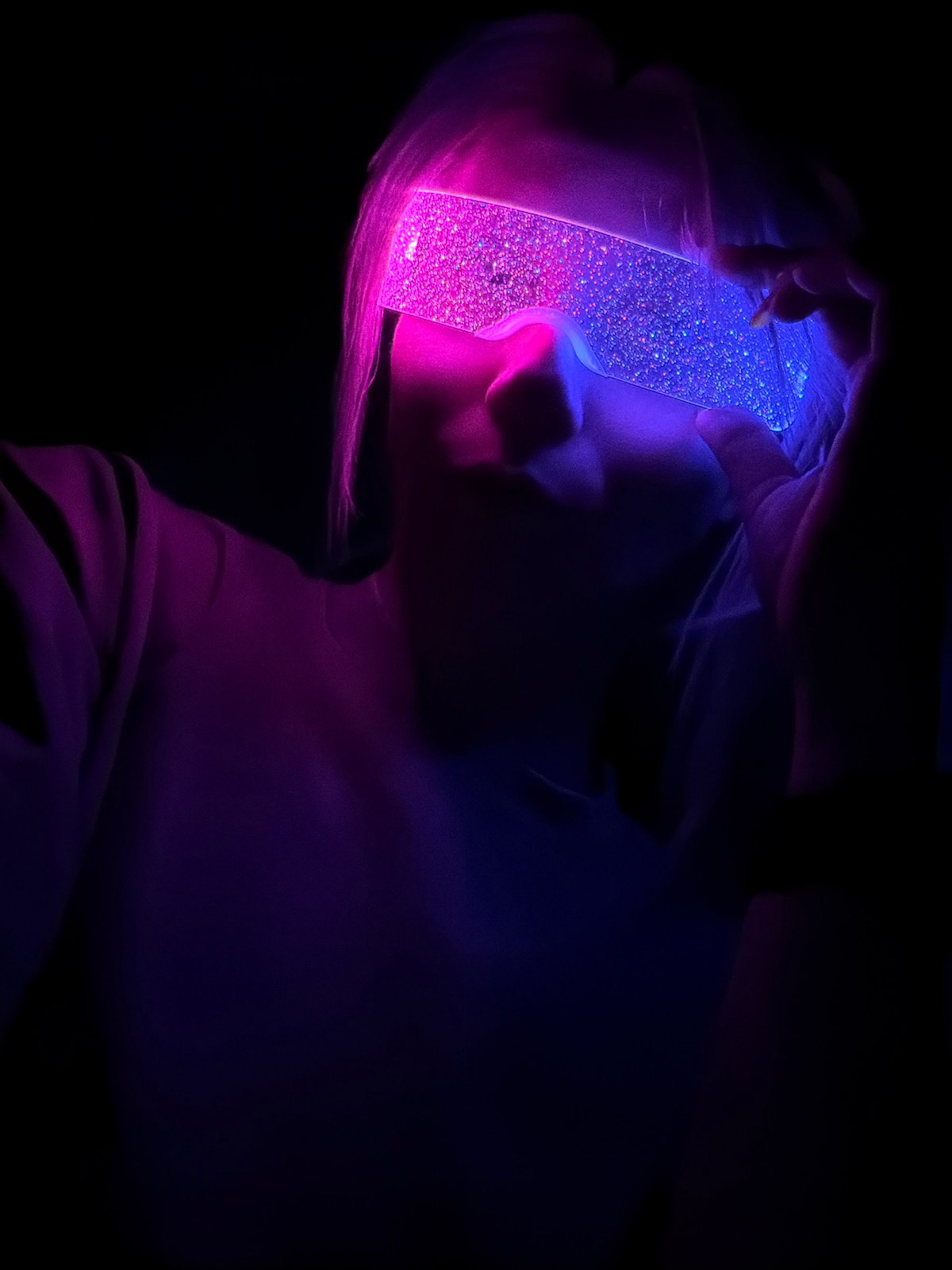Person wears glowing novelty glasses in Chaikovsky, Russia