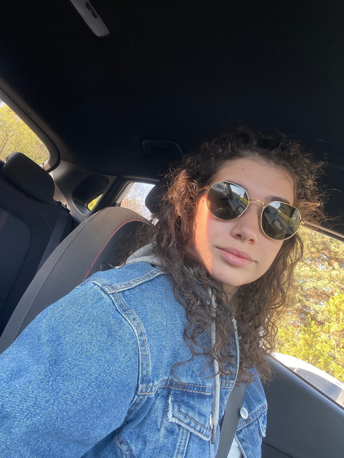 Woman takes morning car selfies in Sofia, Bulgaria