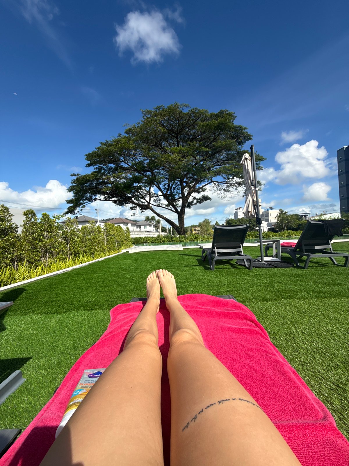 Poolside tanning and snacks at a Ratsada resort