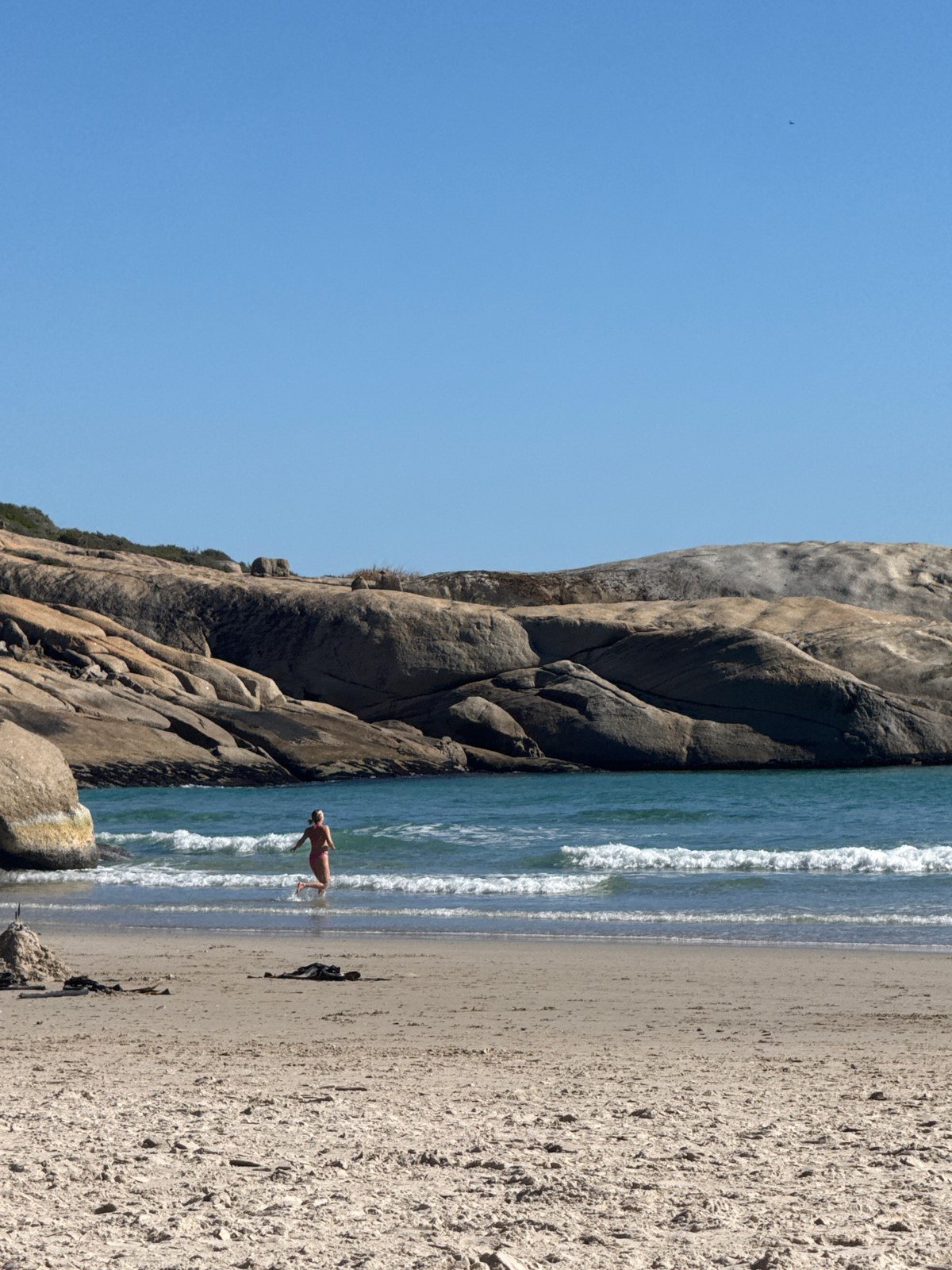 Sunny beach day brings families and surfers to Hout Bay
