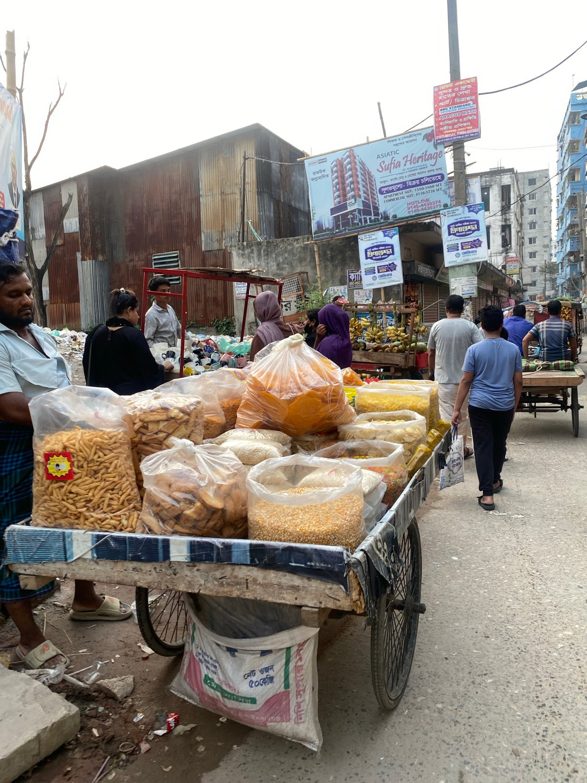 Everyday street life documented across Dhaka neighborhoods Saturday morning