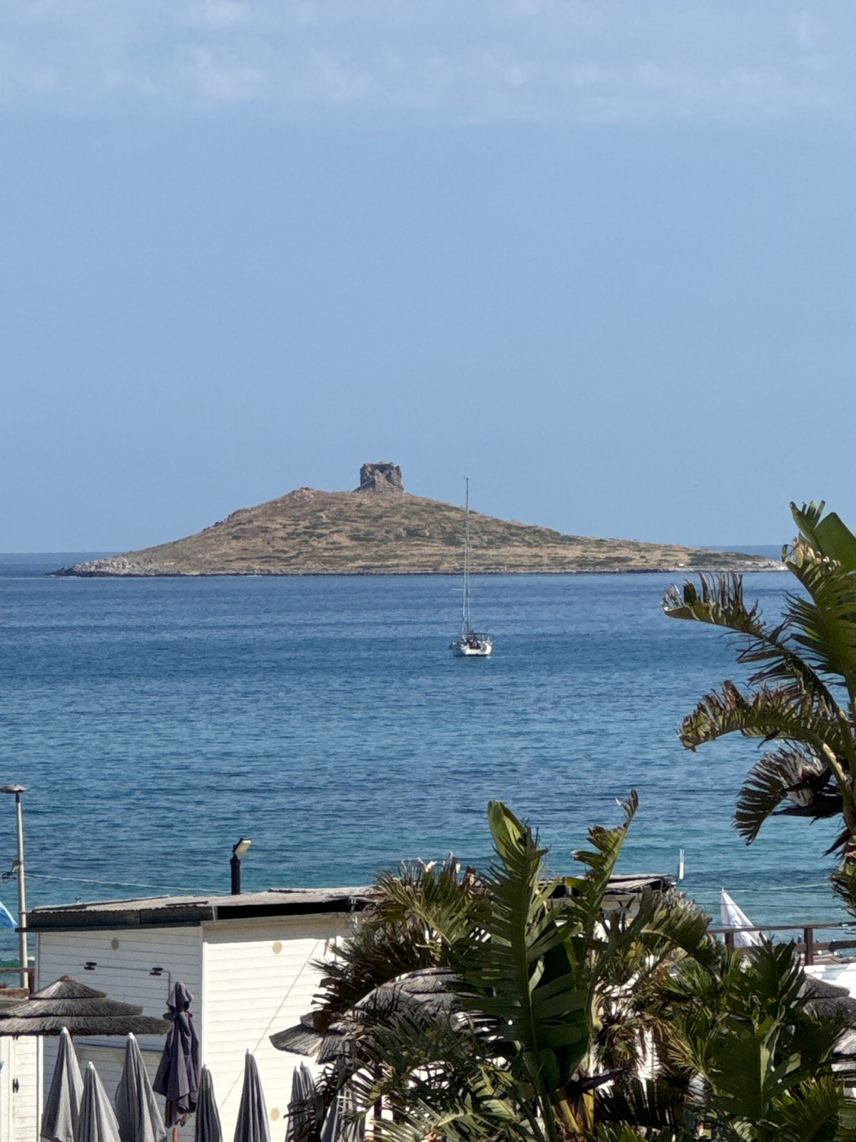 Resort workers maintain Sicilian coastal properties during morning hours