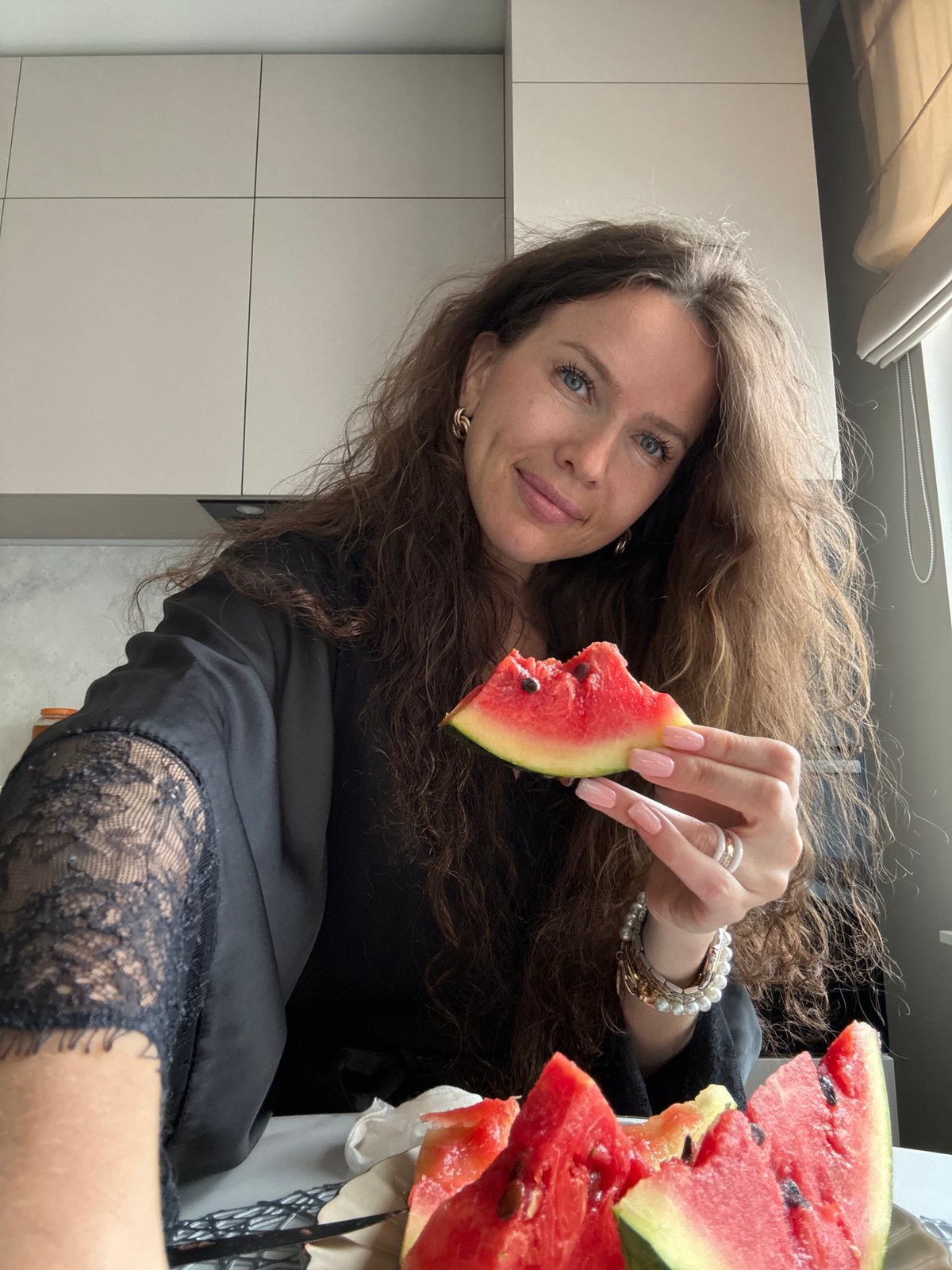 Watermelon snack session at a kitchen table in Khimki