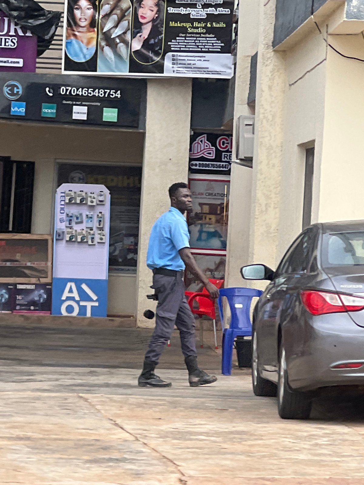 Street life and commerce along a busy Okpanam, Nigeria thoroughfare