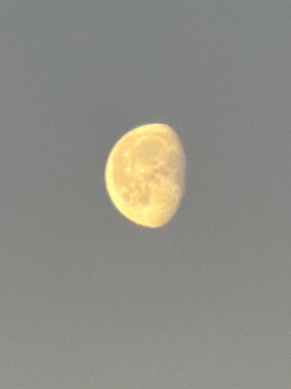 Gibbous moon observed in hazy sky over Luxembourg