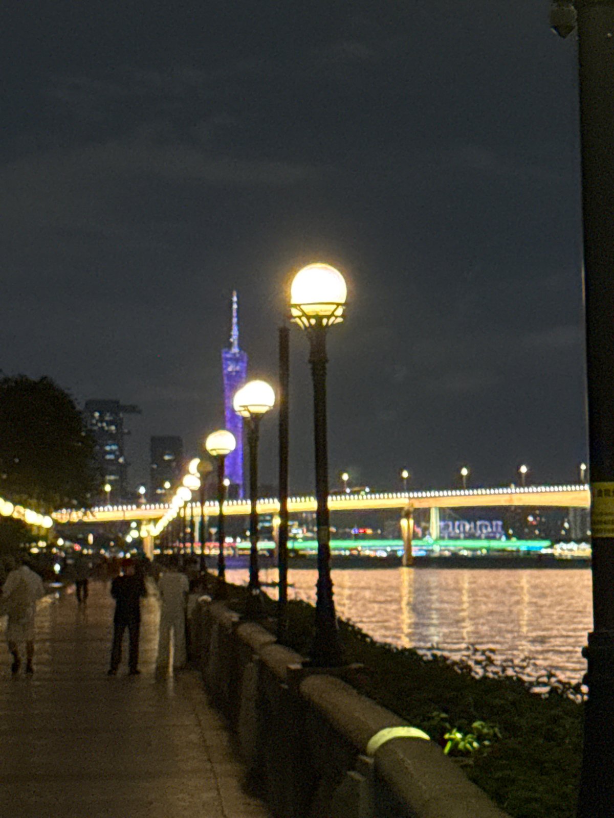 Individual observed at Guangzhou Pearl River waterfront during evening hours