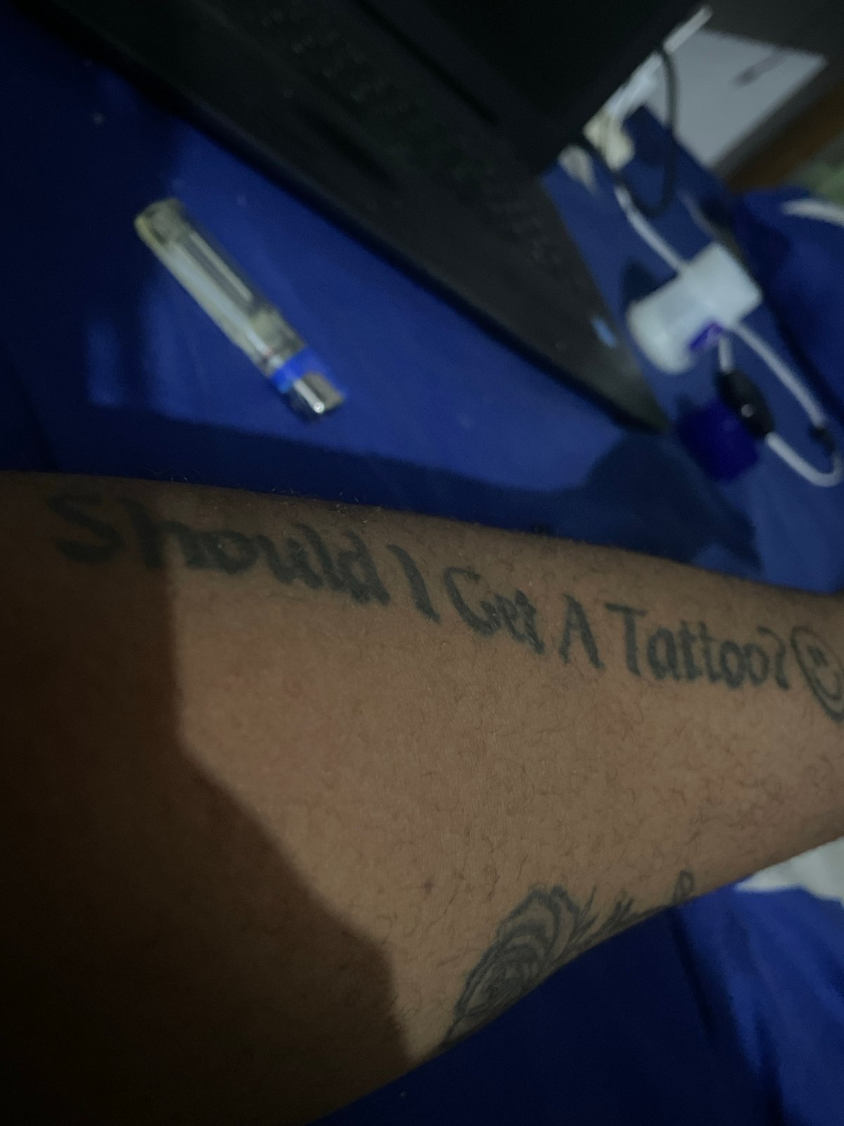 Personal moments captured in Jos: tattoos, lighter, flowers