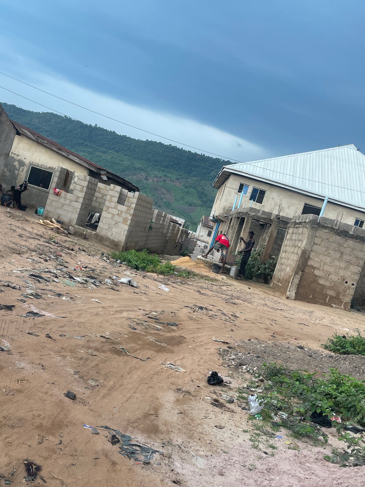 Street life and commerce across Lokoja's dusty, developing neighborhoods