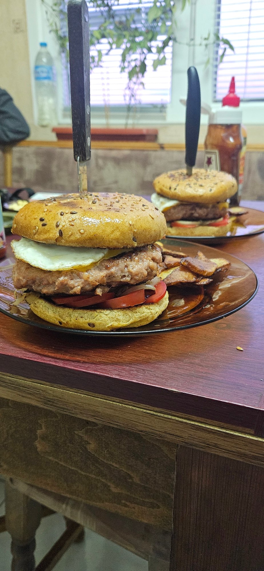Restaurant meal served with knives through sandwiches in Sofia
