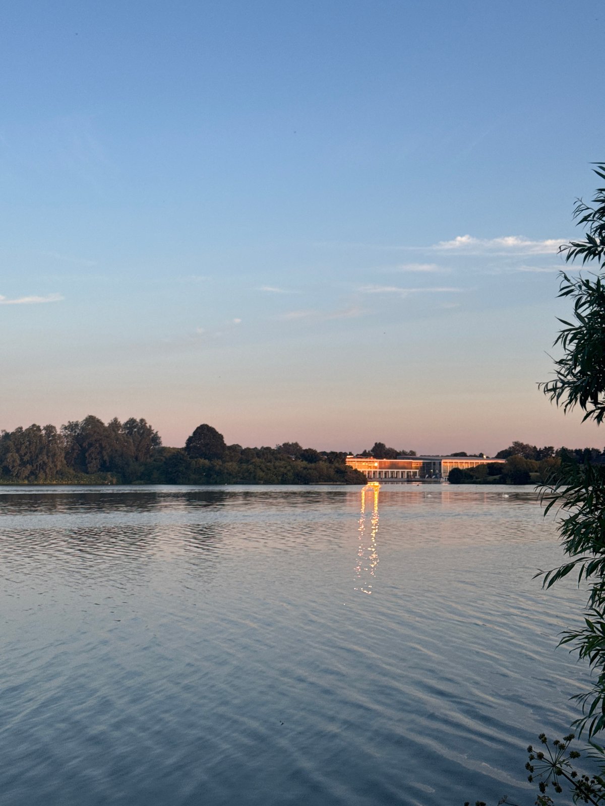 Sunset over Craigavon lake with modern glass building