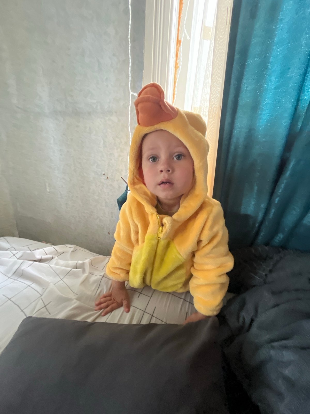 Lazy morning at home with kids in duck costumes