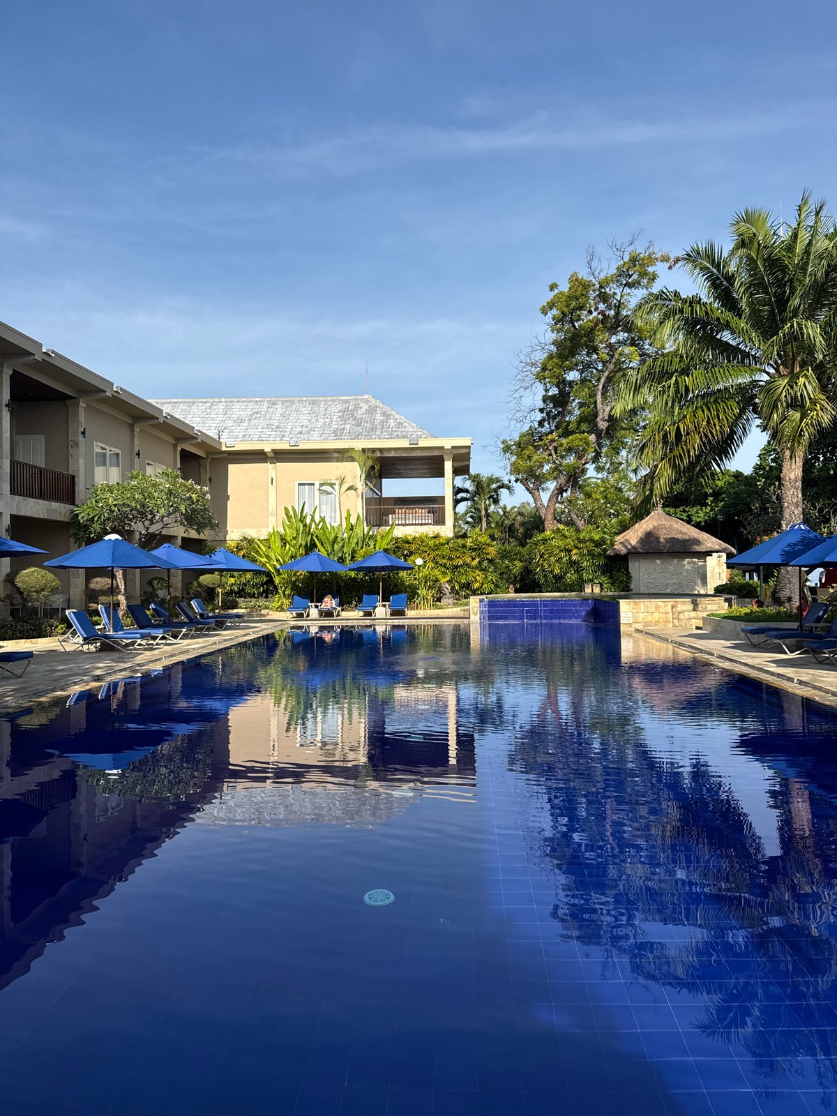 Resort pool and coastal fishing documented in Buleleng, Indonesia