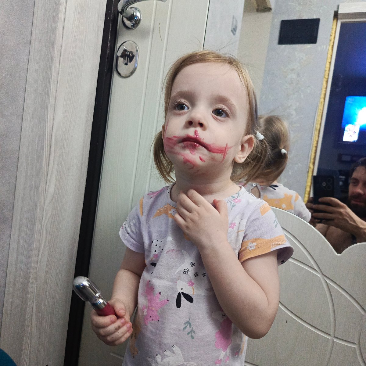 Child experiments with lipstick in Russian bathroom