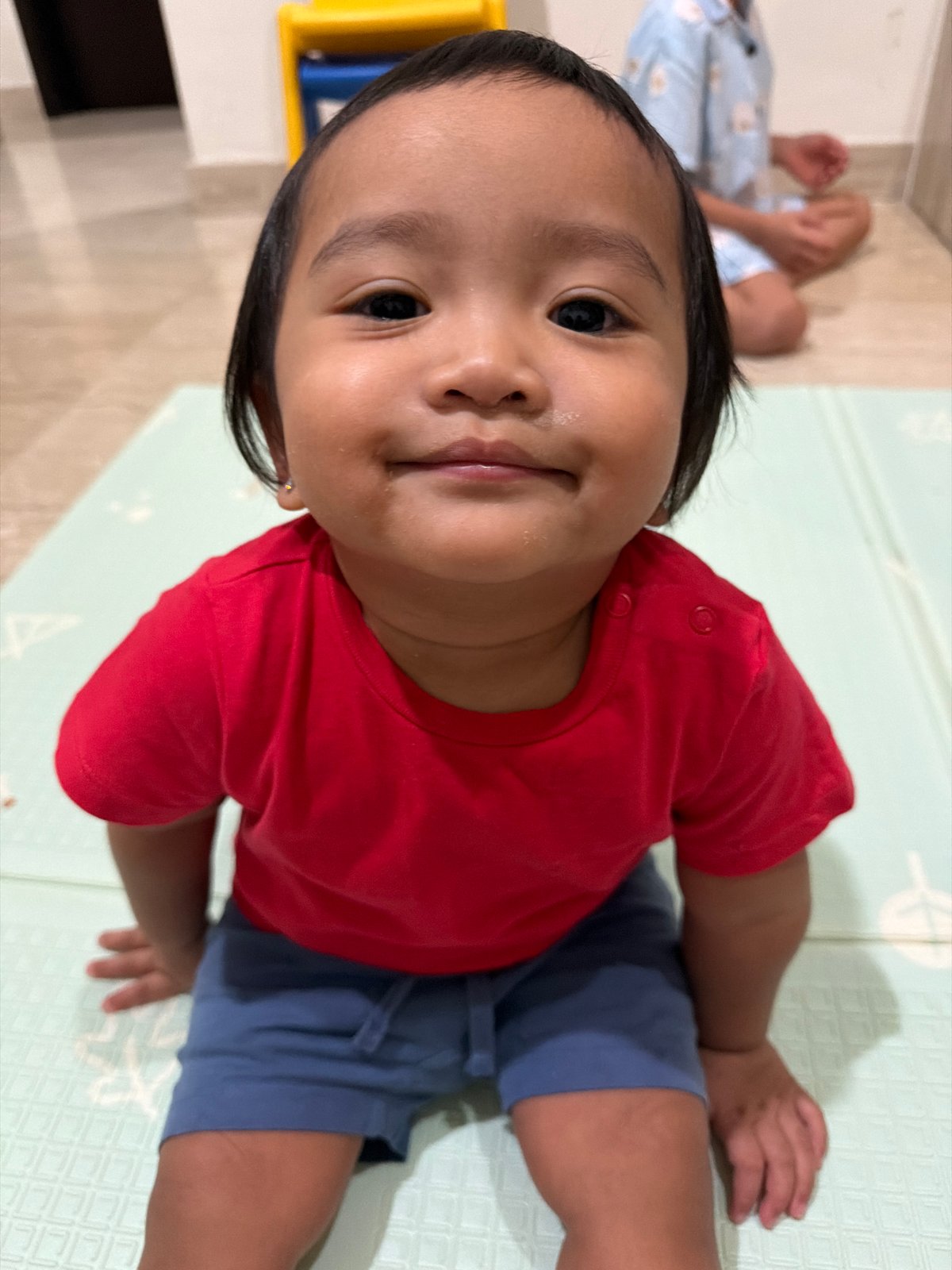 Indoor playtime and a street scene with police lights, Central Jakarta