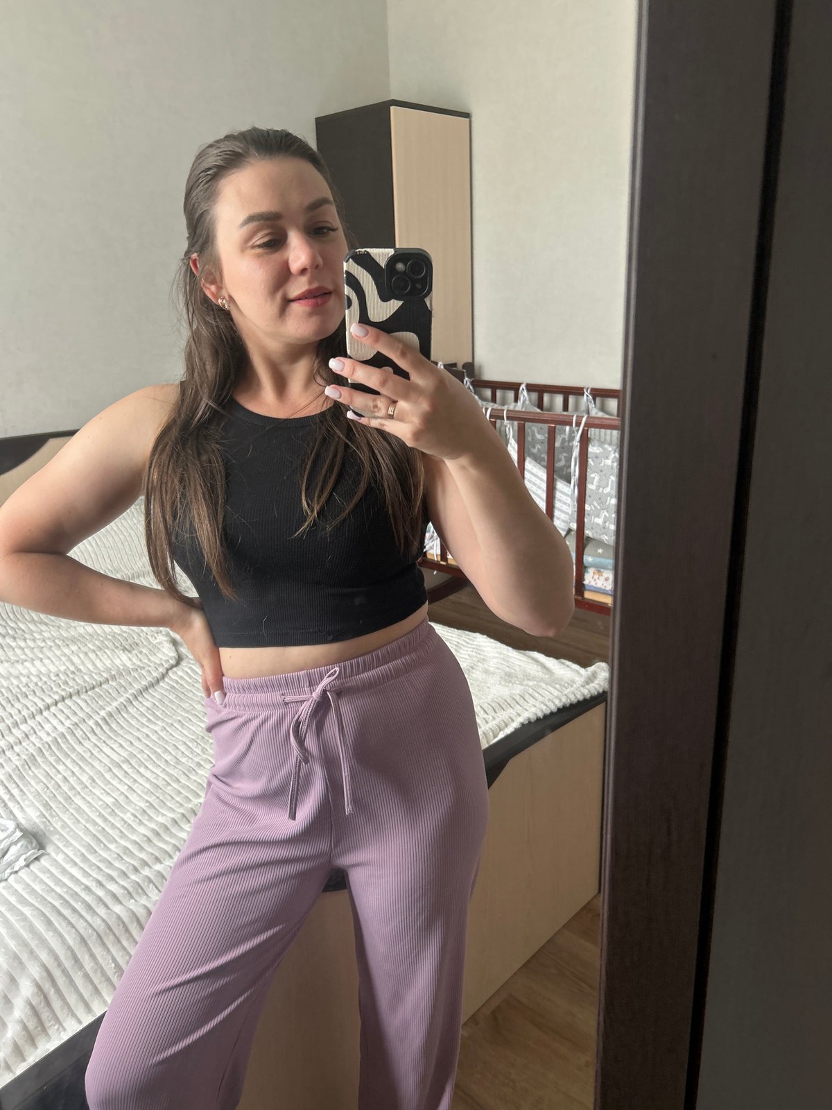 Woman takes bedroom selfies in Chaikovsky, child also photographed