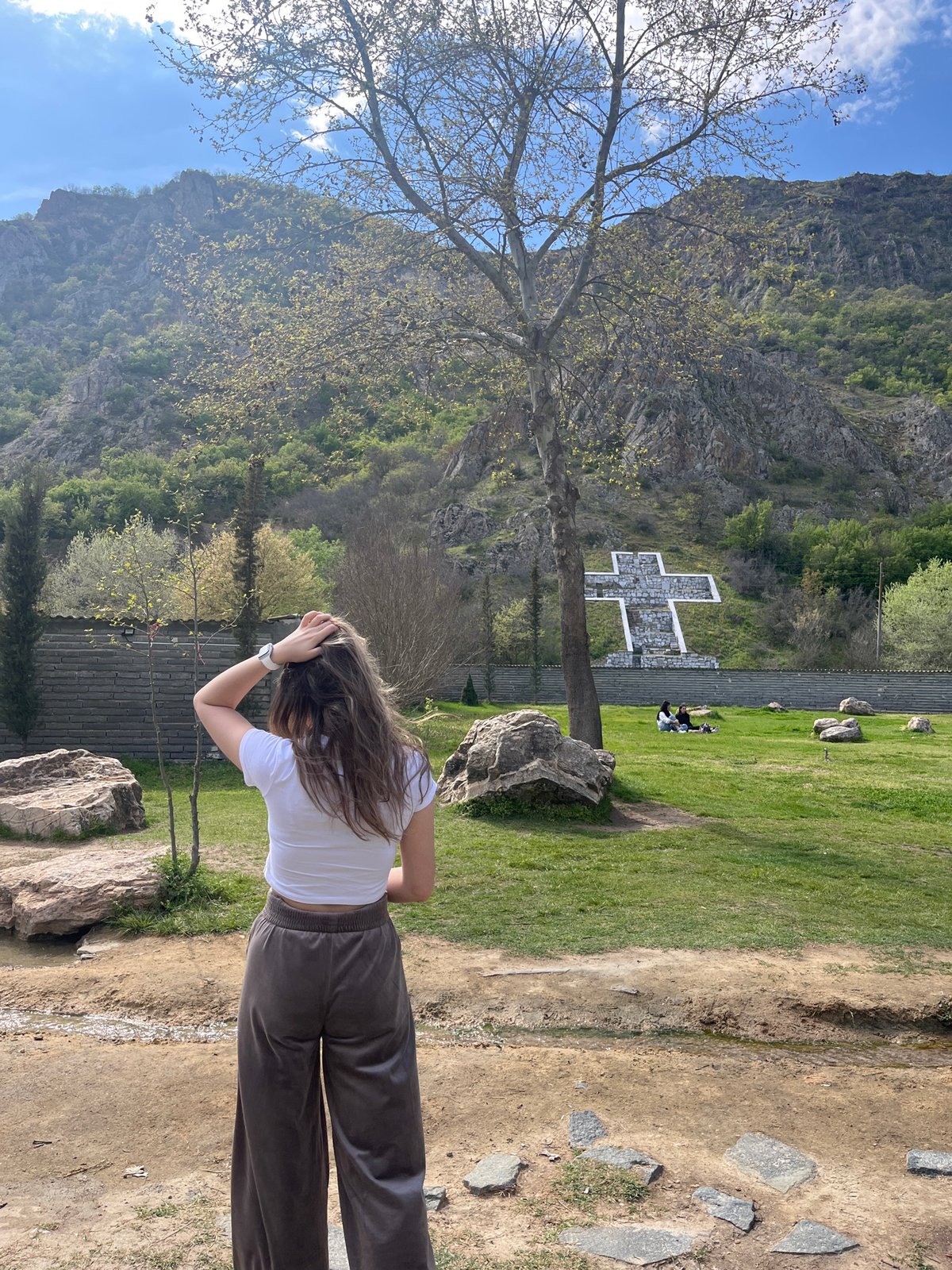 Woman visits turtle pond in Bulgarian village