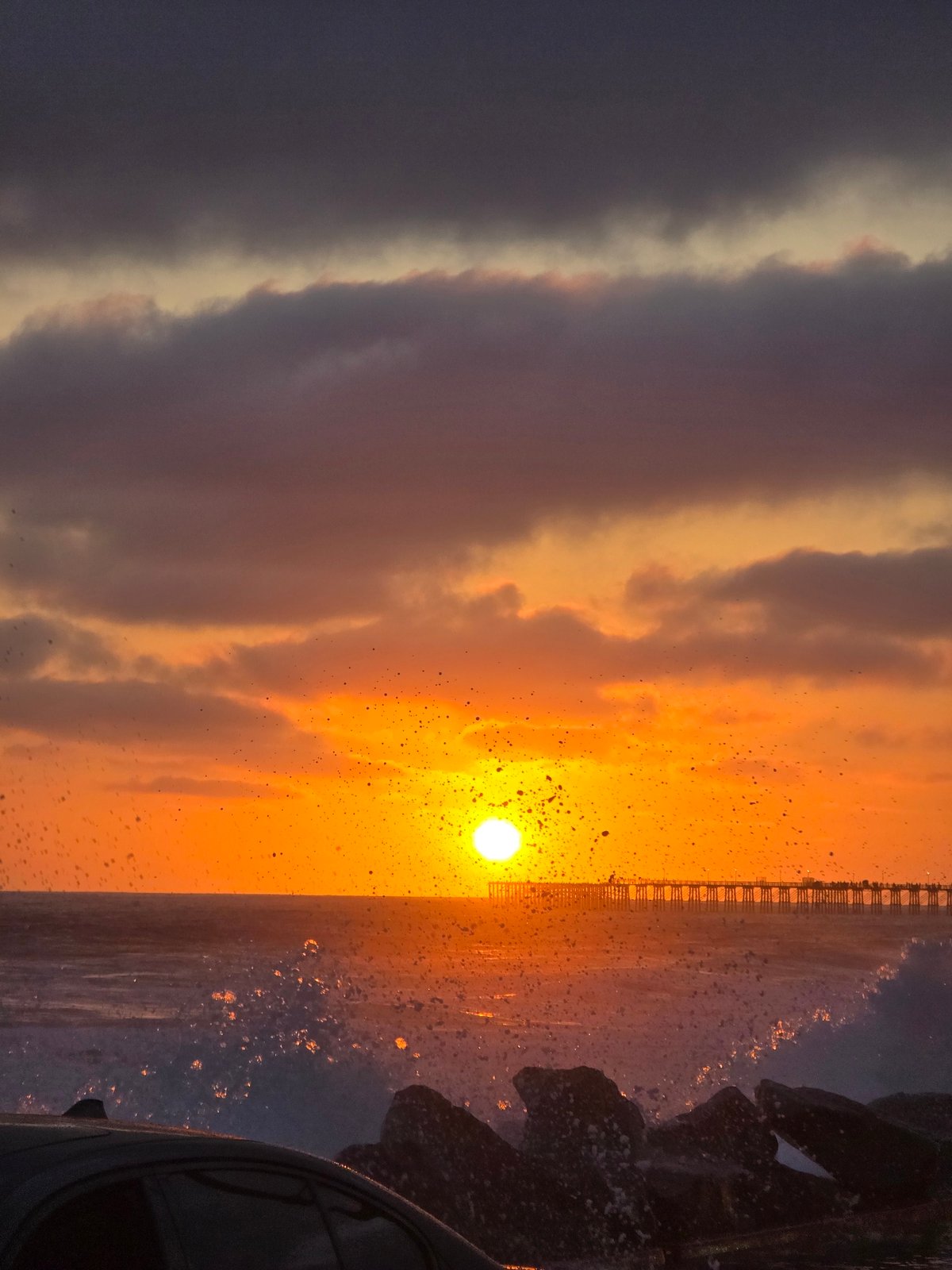 Sunset storm watching along Oceanside's coastline