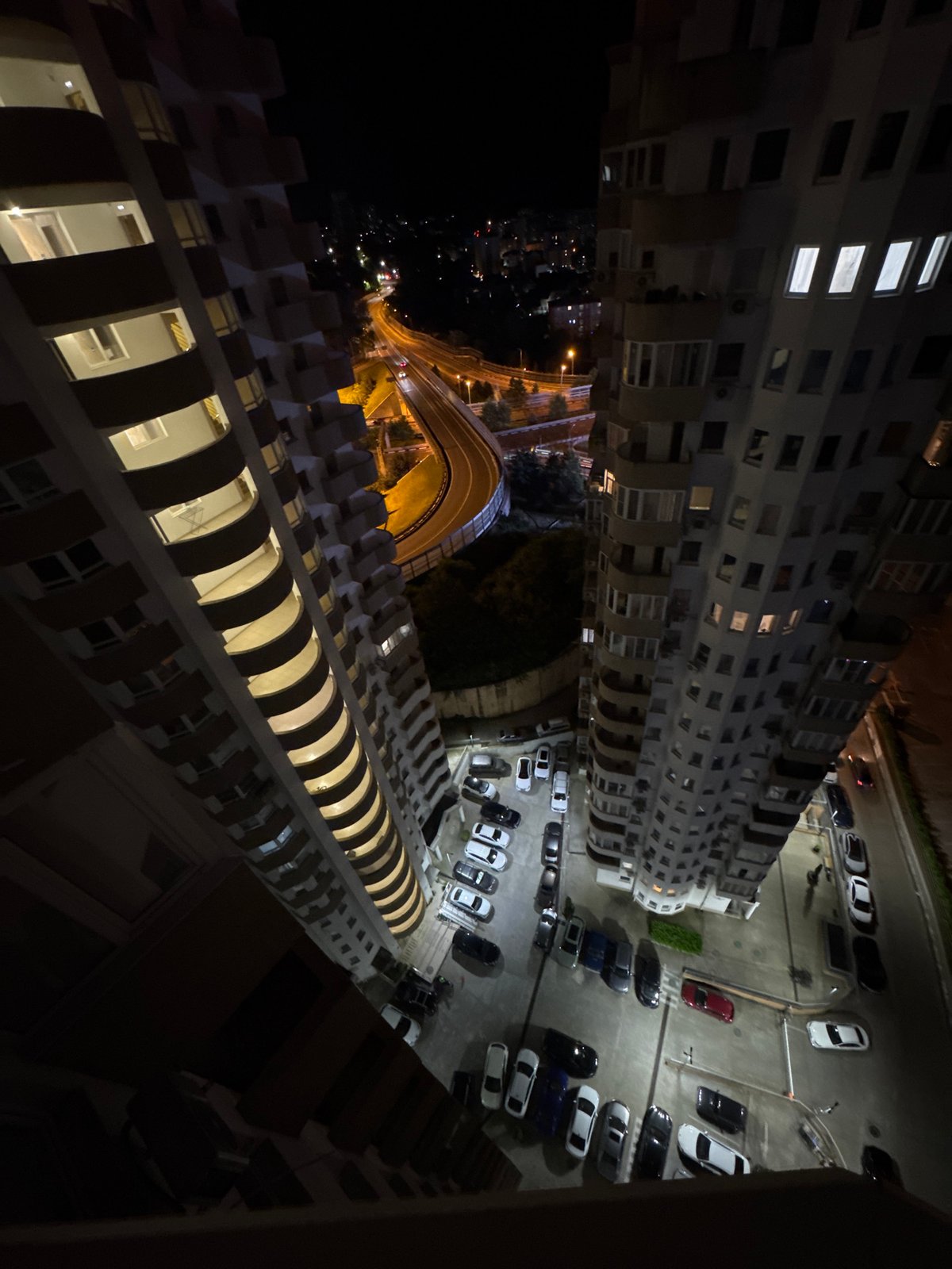 Nighttime elevated highway documentation in Sochi residential district
