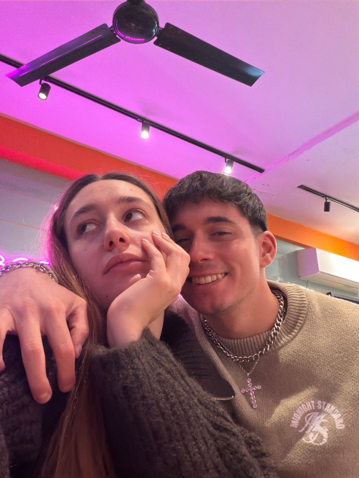 Young couple takes selfies during restaurant visit in Sofia