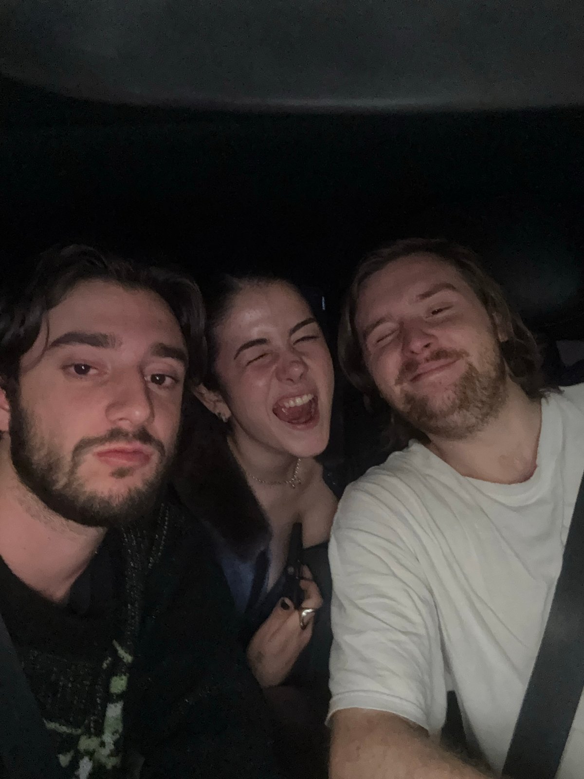 Three people take selfie indoors in Huixquilucan, Mexico
