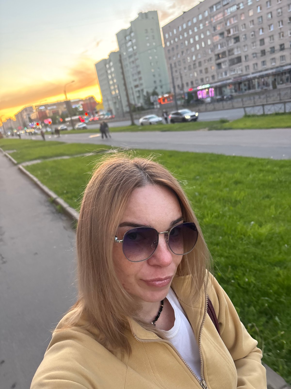 Evening street life documented in Sinyavino, Russia during sunset