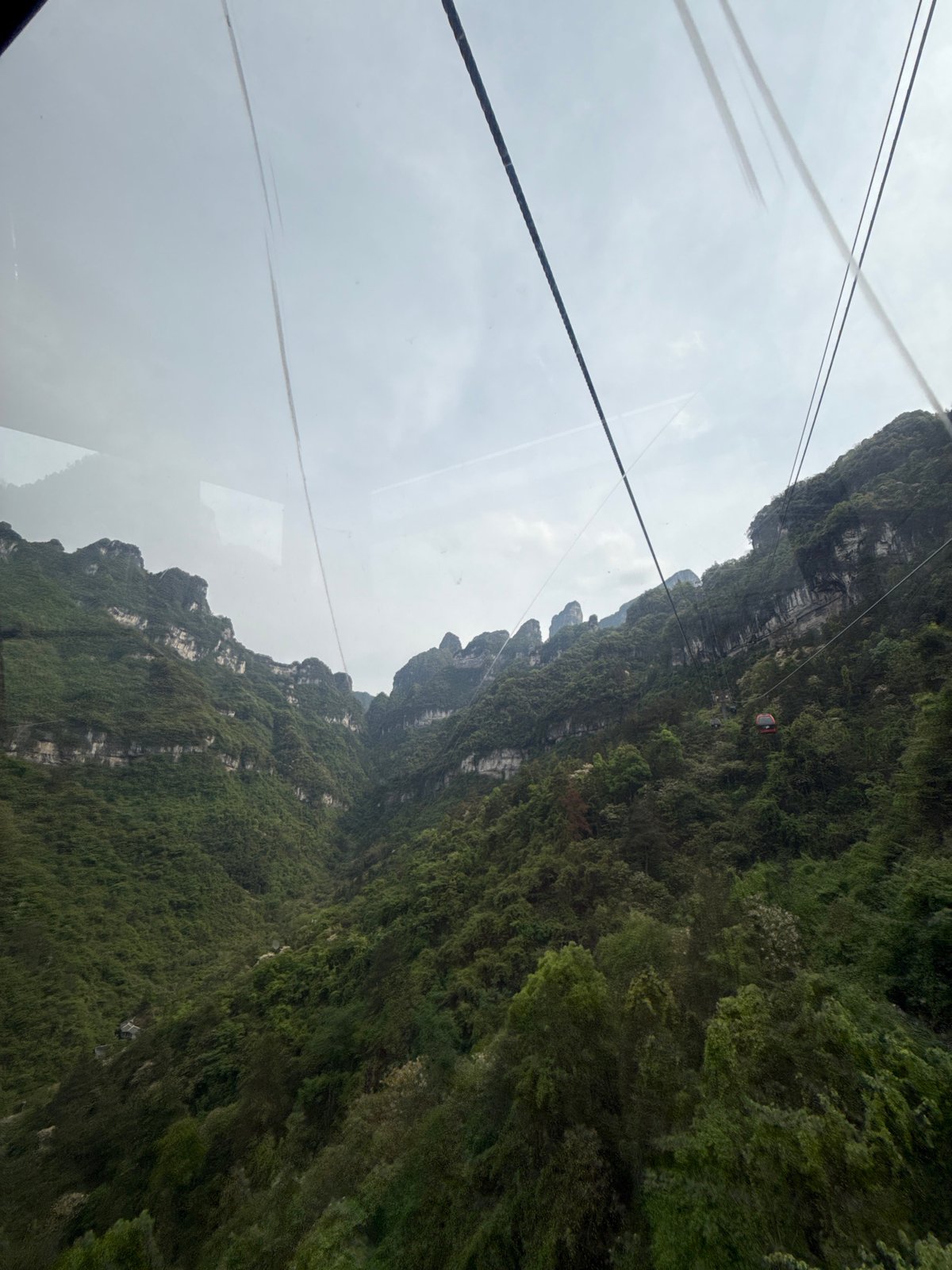 Tourist captures scenic mountain views from Zhangjiajie cable car