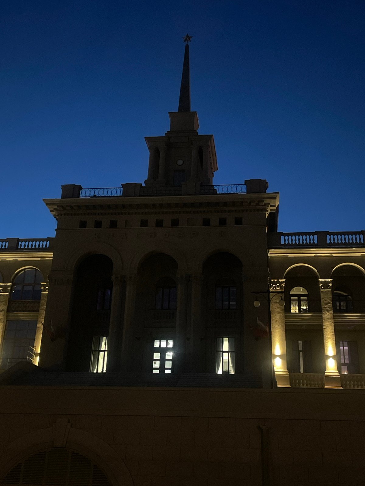 Krasnoyarsk nighttime cityscape documented across waterfront and grand architecture
