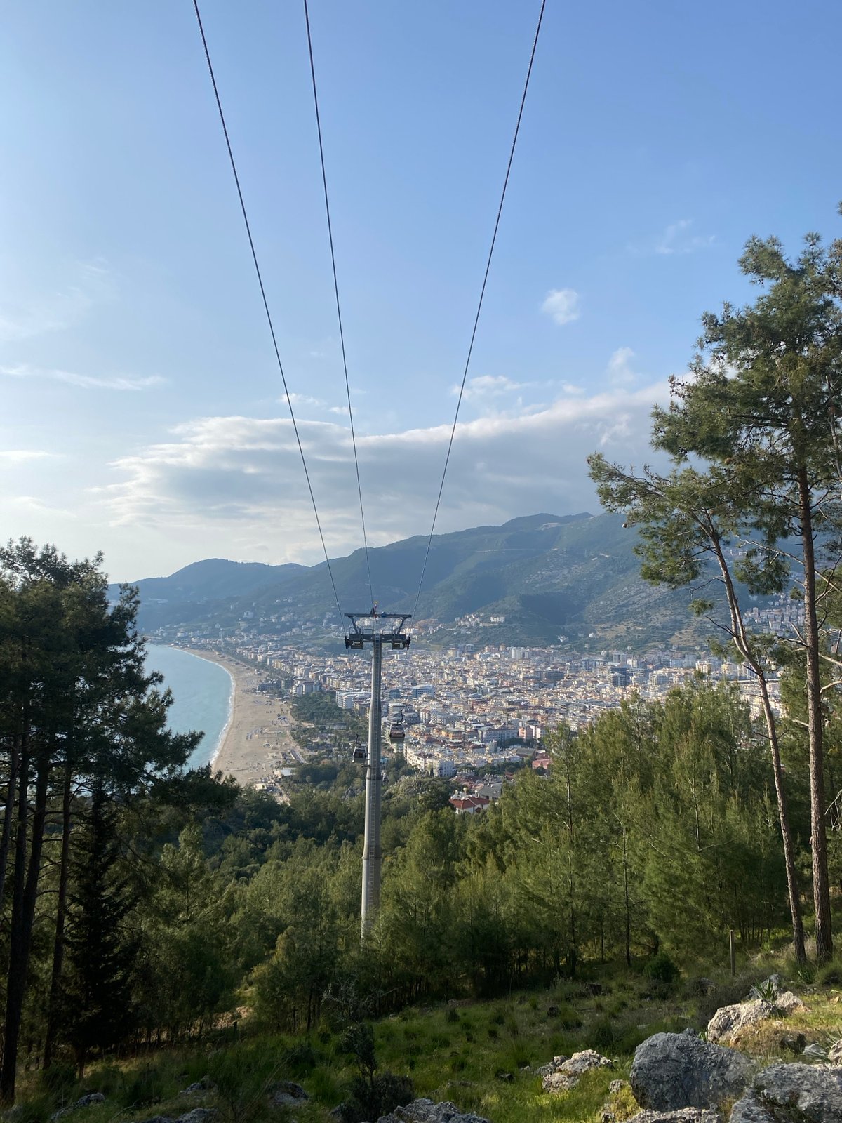 Cable car tour documents Alanya's coastal cityscape and mountains