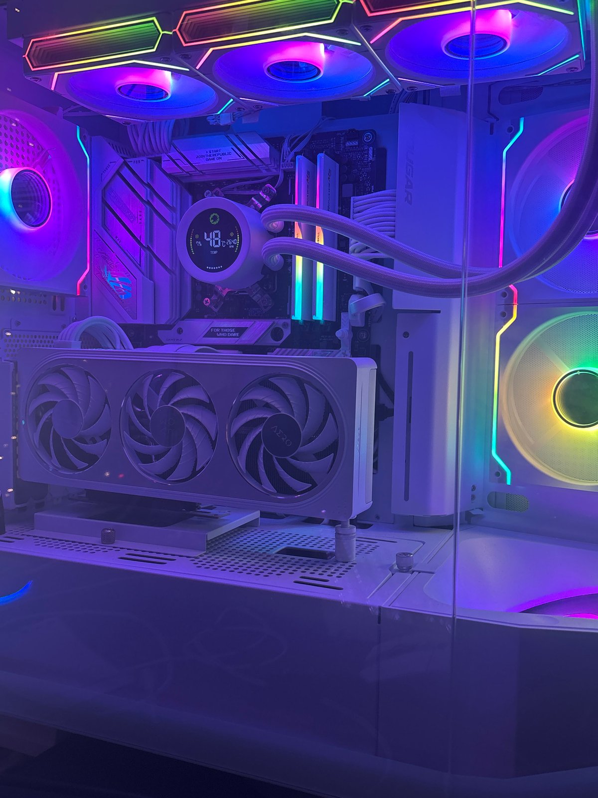 RGB-heavy white PC build and peripherals shot from multiple angles