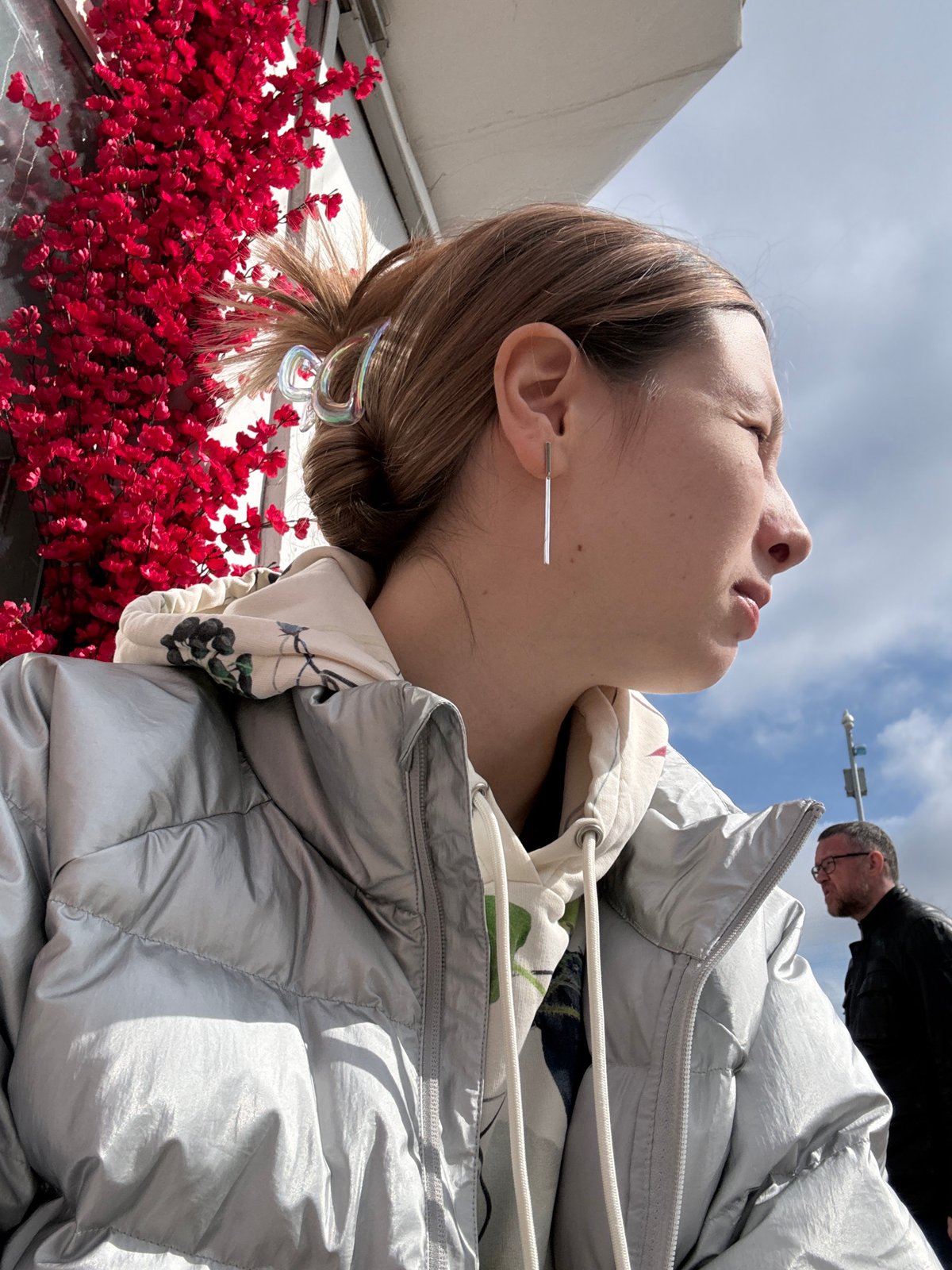 Woman takes selfies on Moscow street near construction site