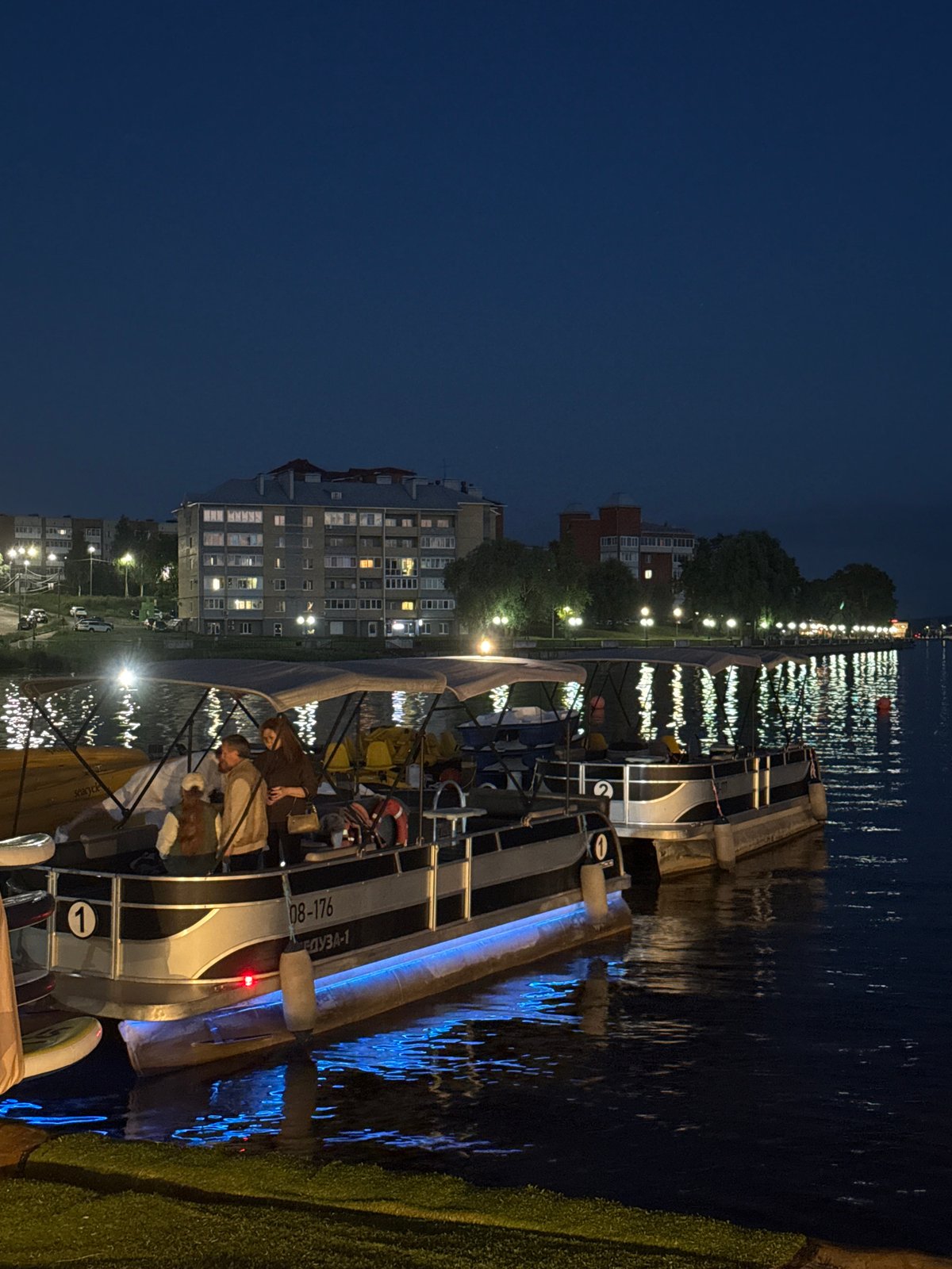 Evening waterfront activities and personal moments documented in Votkinsk