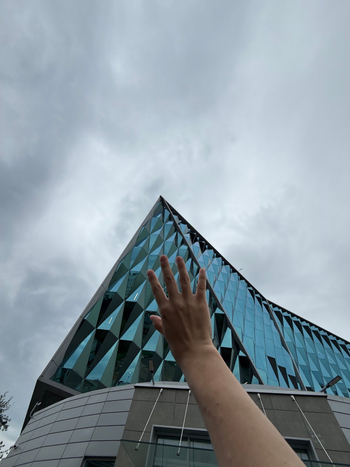 Hanging outside a bold geometric glass building in Moscow